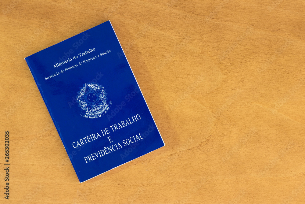 Brazilian social security document on wooden table Brazilian social security document on wooden table