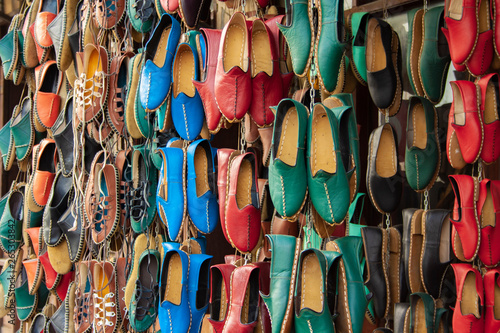 Traditional colorful Turkish handmade leather slipper shoes on a market in Gaziantep, Turkey. © 0804Creative