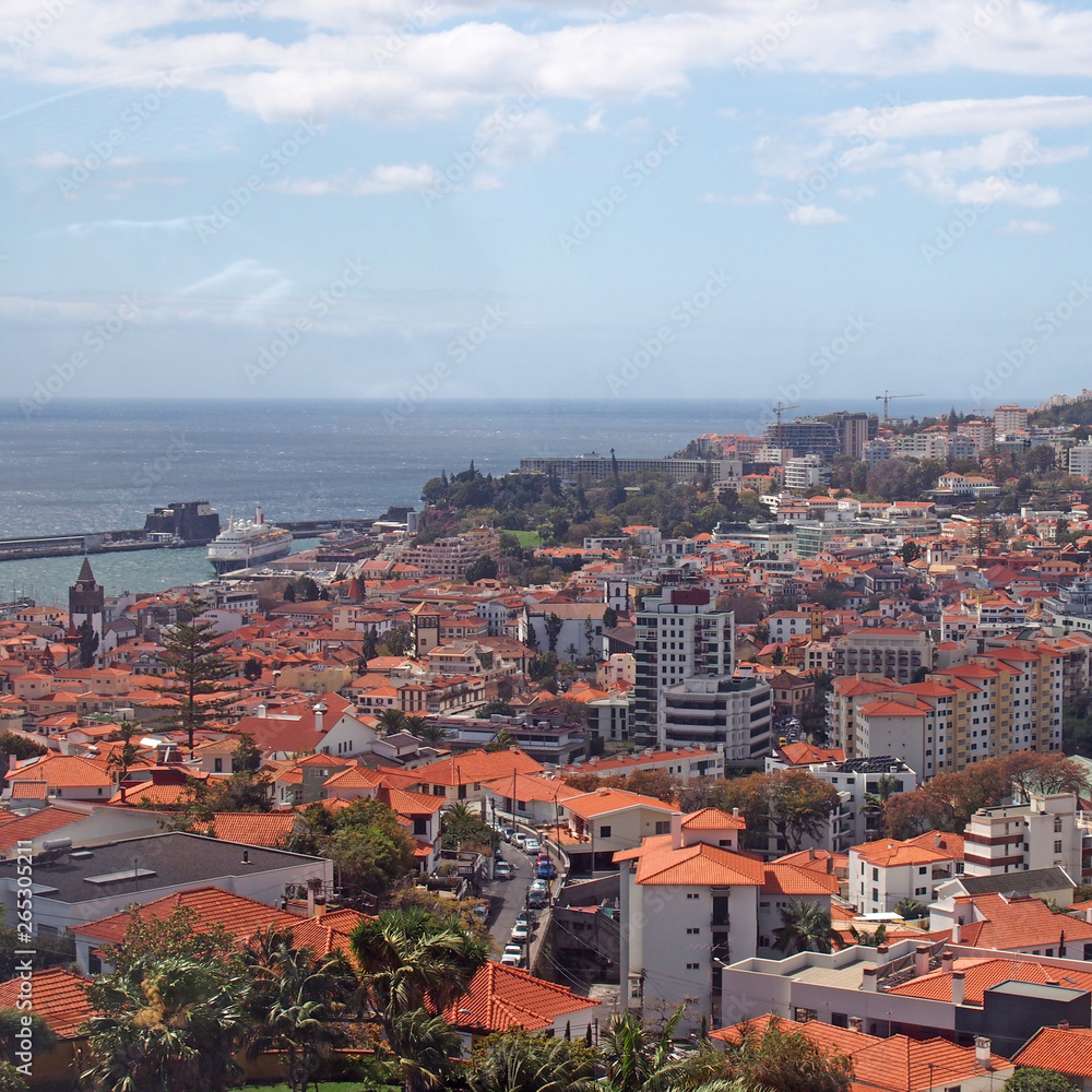 high angle view of the city of funchal in madeira with the harbor and sea in the distance