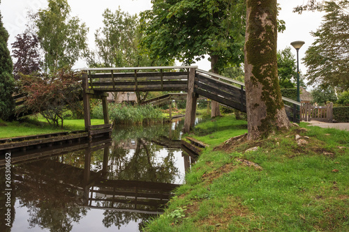 Wooden bridges over a canal in Giethoorn