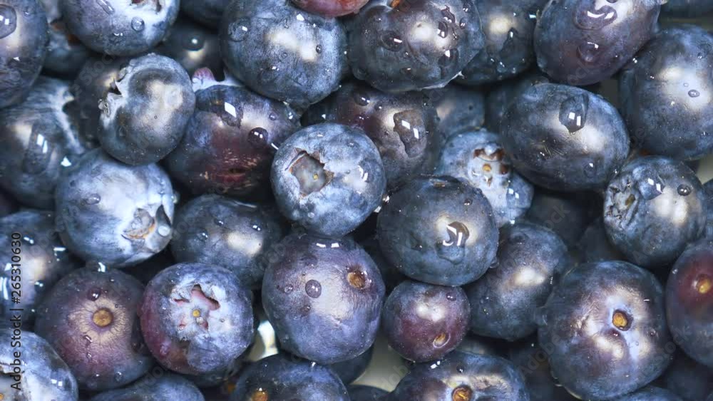 fruit close-up, blue blueberries background, fresh fruit rotating fruit close-up, blue blueberries background, fresh fruit rotating
