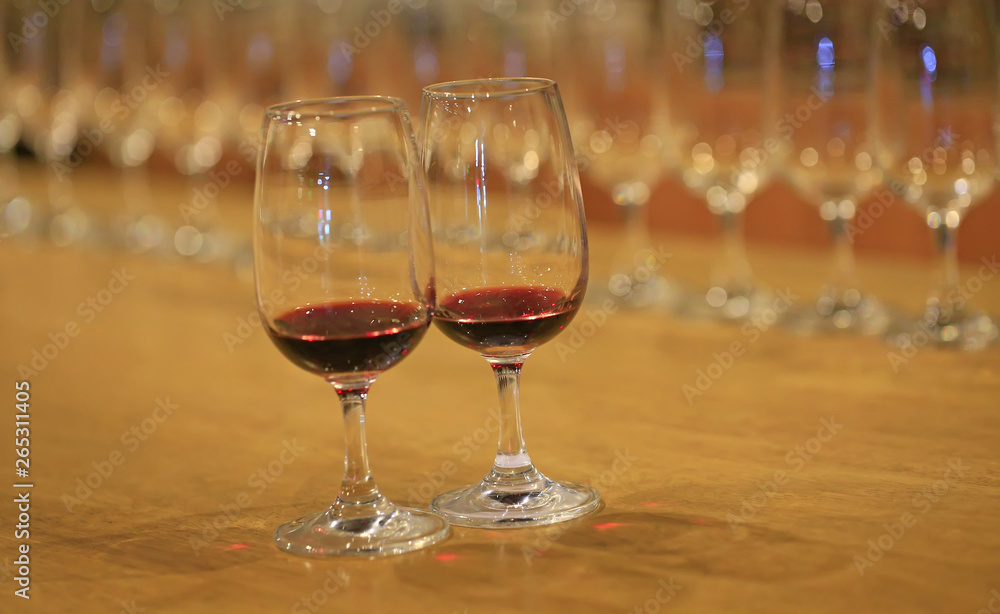 A glass of red wine is on the table A glass of red wine is on the table