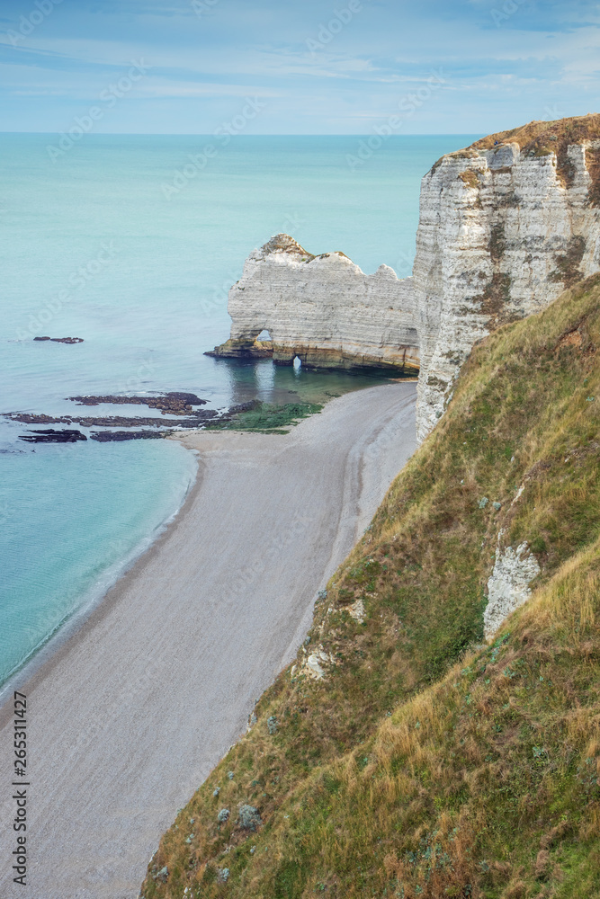 The Falaise d'amont with an empty beach, seen from Etretat
