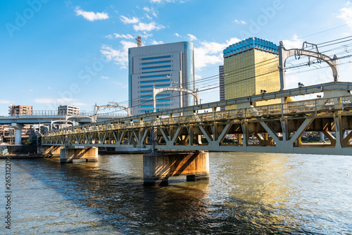 Empty Railway Bridge Over a River on a Sunny Early Spring Day. Tokyo, Japan. © alpegor