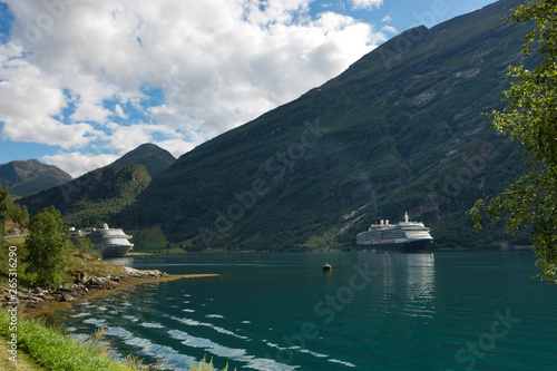 Two Cruise Ships with Engines turned on, in the famous Geiranger Fjord in Norway