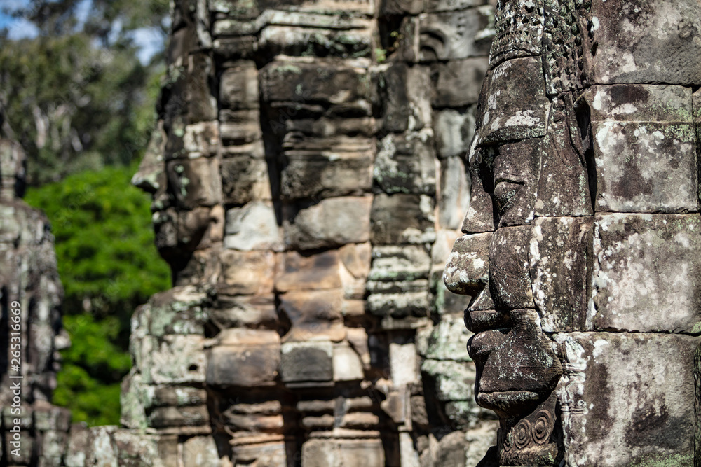 Beautiful face sculptures at the famous Bayon temple in the Angkor Thom temple complex, Siem Reap, Cambodia Beautiful face sculptures at the famous Bayon temple in the Angkor Thom temple complex, Siem Reap, Cambodia