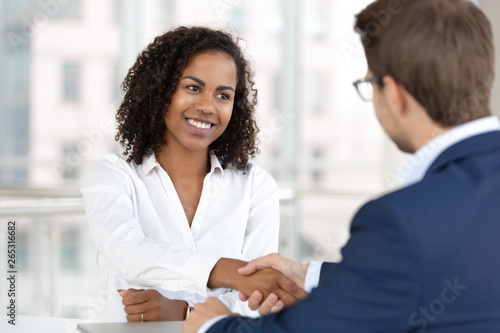 Wallpaper Mural Smiling african hr manager handshake hire candidate at job interview Torontodigital.ca