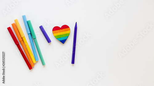 Rainbow heart with felt pens on white table