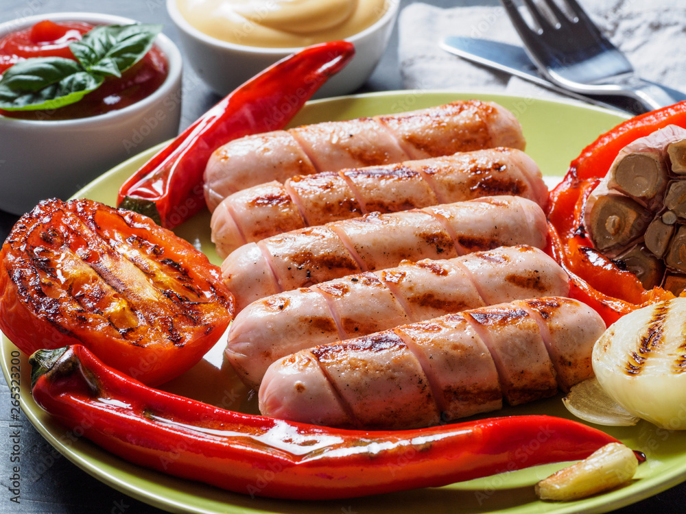 Φωτογραφία Close up view of chicken homemade sausages with sauces ketchup and mustard