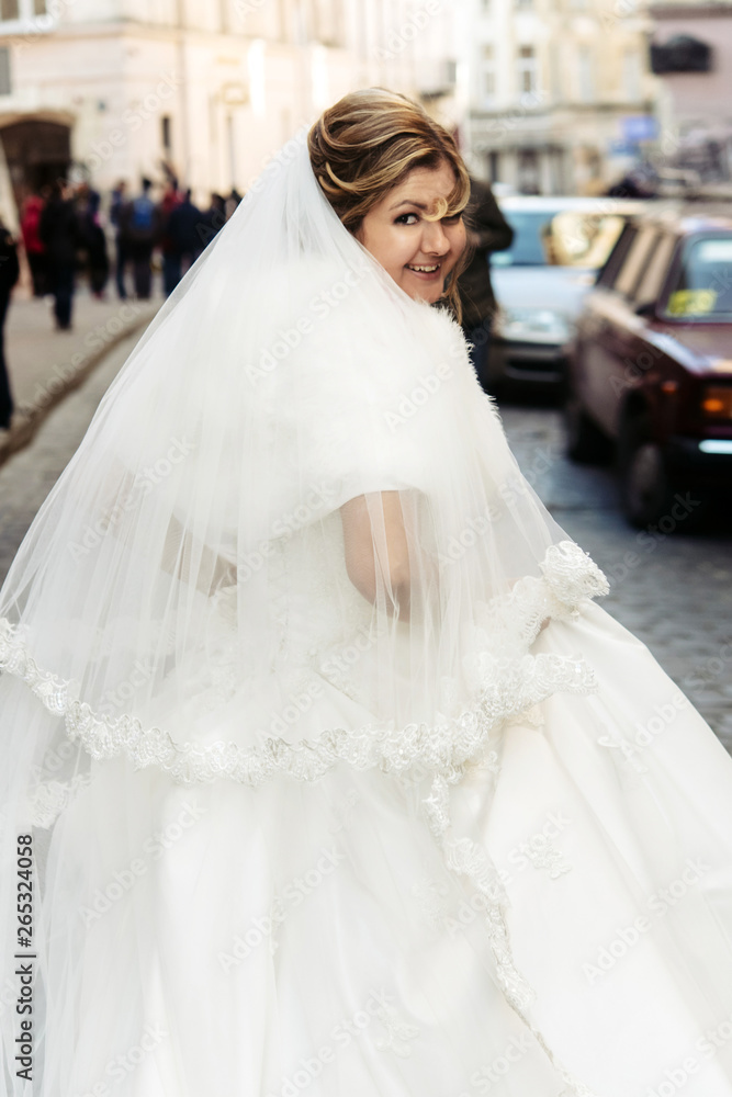 happy luxury bride running and stylish groom having fun emotions on the background old sunny city happy luxury bride running and stylish groom having fun emotions on the background old sunny city