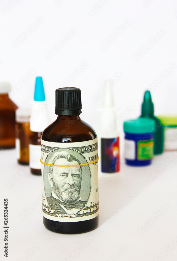 dollar on a bottle of medicine on the background of medical drugs dollar on a bottle of medicine on the background of medical drugs