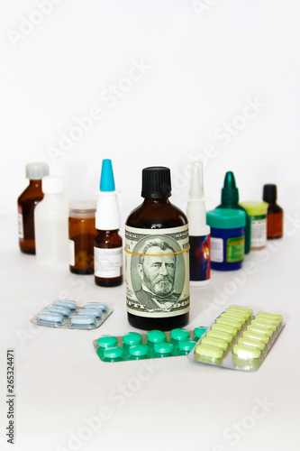 dollar on a bottle of medicine on the background of medical drugs