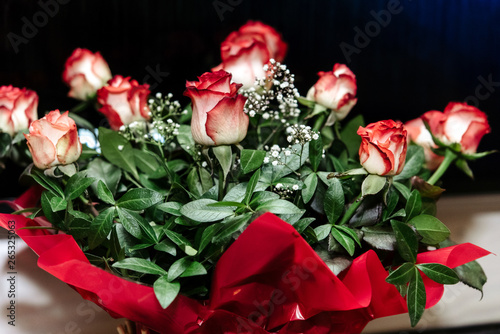 beautiful rich bouquet of red roses at wedding ceremony  gift concept