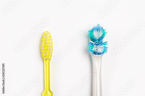The old toothbrush and new toothbrush isolated on a white background.
