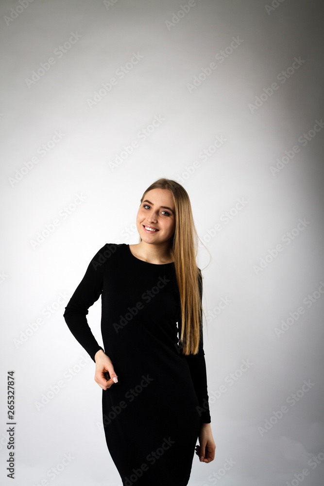 Young woman in black on bright background. Young woman in black on bright background.