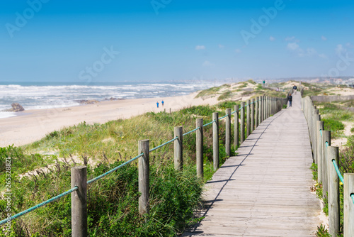 Fototapeta Naklejka Na Ścianę i Meble -  Wooden boardwalk at the Praia da Frente Azul, in english the blue beach front in the seaside resort Espinho