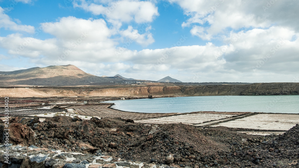 Sunset at Salinas de Janubio. Old salt pans in the south of Lanzarote were they harvest salt the traditional way Sunset at Salinas de Janubio. Old salt pans in the south of Lanzarote were they harvest salt the traditional way