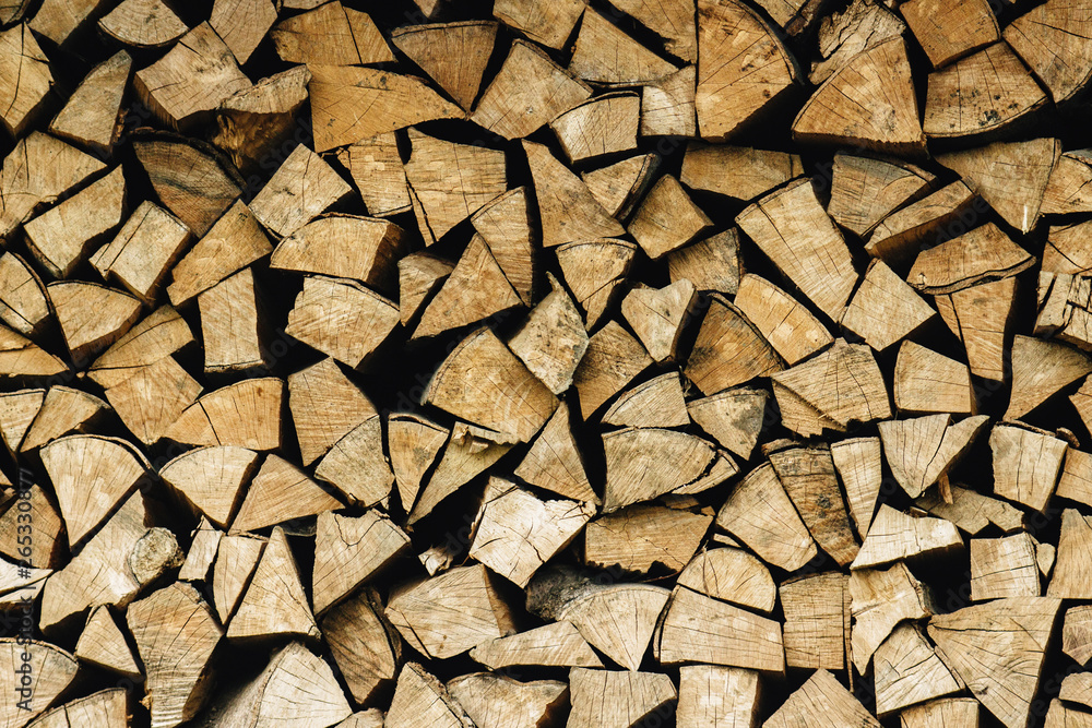 natural stocked firewood in a pile, wooden abstract background, energy enviroment concept natural stocked firewood in a pile, wooden abstract background, energy enviroment concept