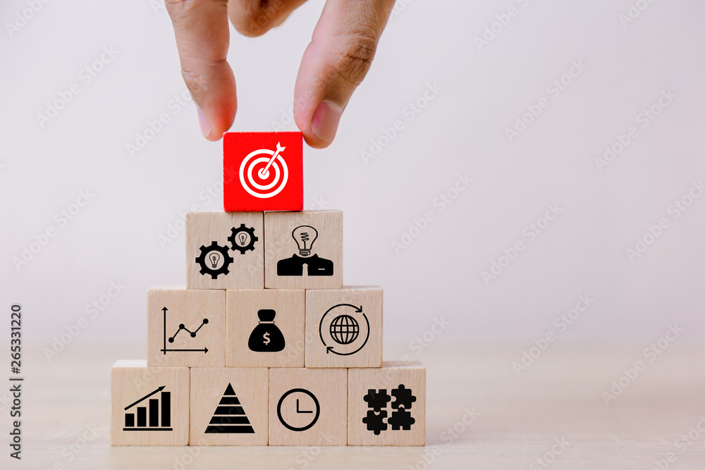 Hand Closer up hands of businessmen,stacking wooden blocks into steps,Concept of business growth success Hand Closer up hands of businessmen,stacking wooden blocks into steps,Concept of business growth success