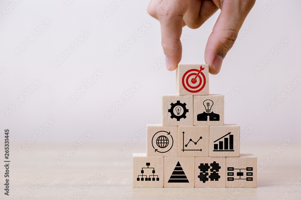 Hand Closer up hands of businessmen,stacking wooden blocks into steps,Concept of business growth success Hand Closer up hands of businessmen,stacking wooden blocks into steps,Concept of business growth success