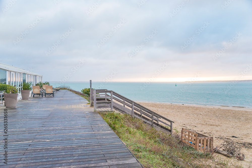 Beach holidays concept: beautiful sunrise on the sand beach with Beach holidays concept: beautiful sunrise on the sand beach with