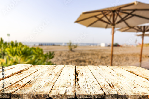 Table background of free space for your decoration and morning blurred background of beach and sea 