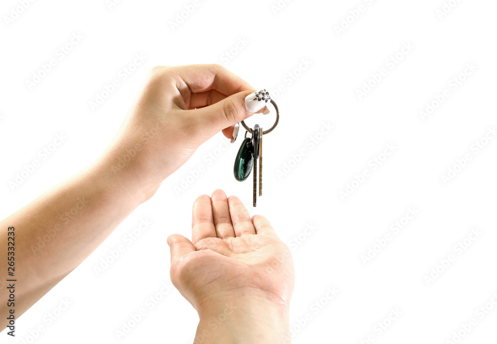 hand gives keys to hand on white background hand gives keys to hand on white background