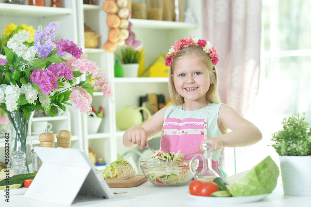 Portrait of cute little girl making dinner Portrait of cute little girl making dinner