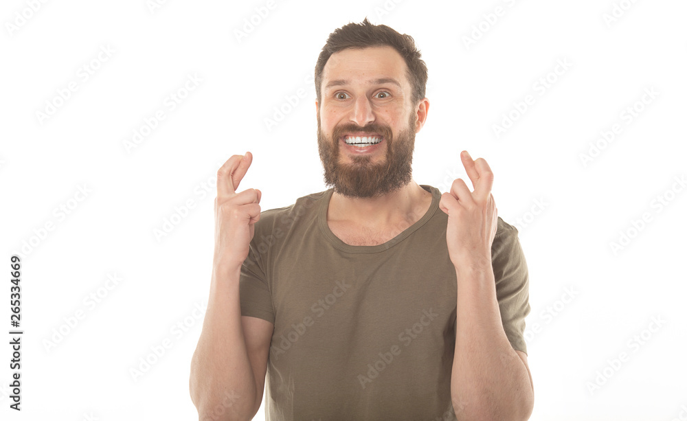 Handsome man with his fingers crossing Handsome man with his fingers crossing