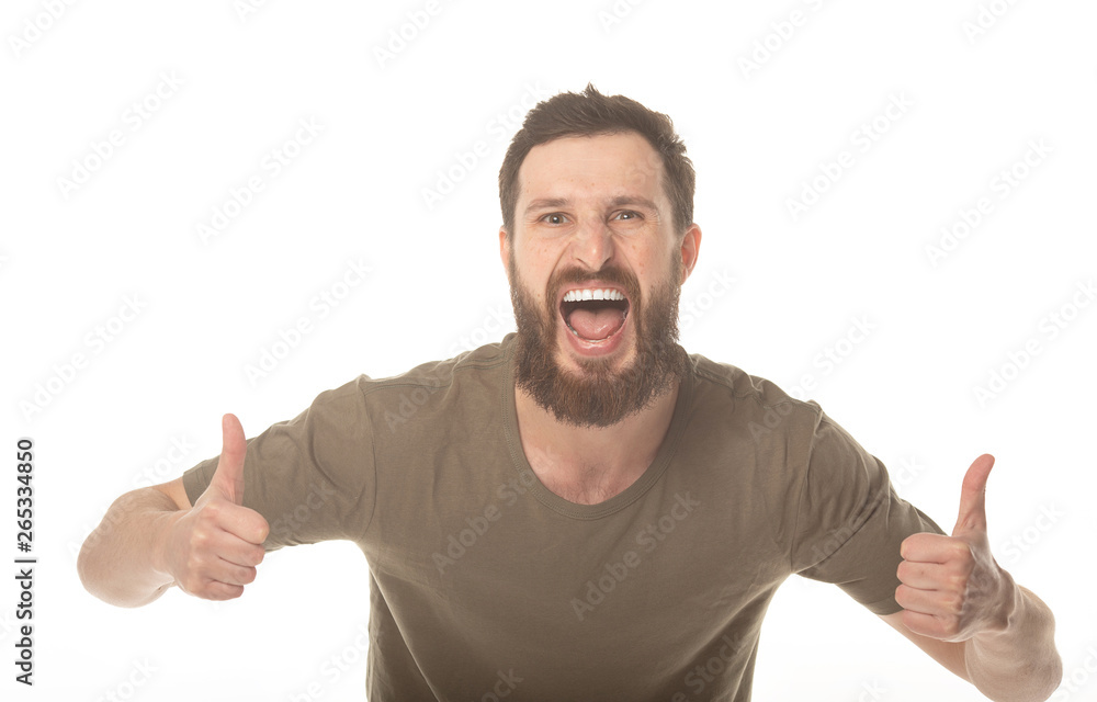Portrait of a handsome young bearded man laughing Portrait of a handsome young bearded man laughing