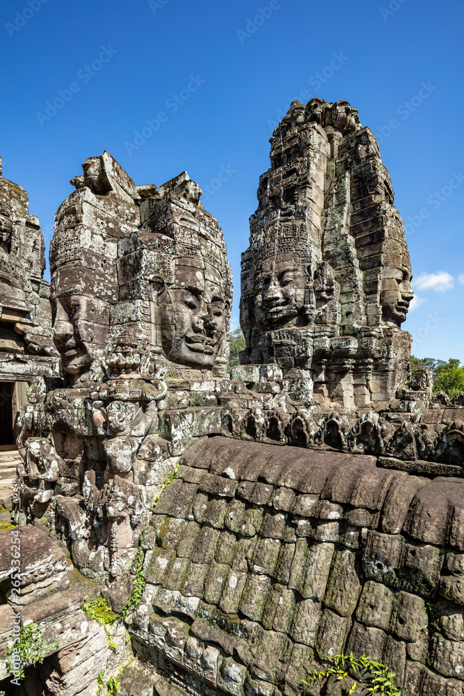 Beautiful face sculptures at the famous Bayon temple in the Angkor Thom temple complex, Siem Reap, Cambodia