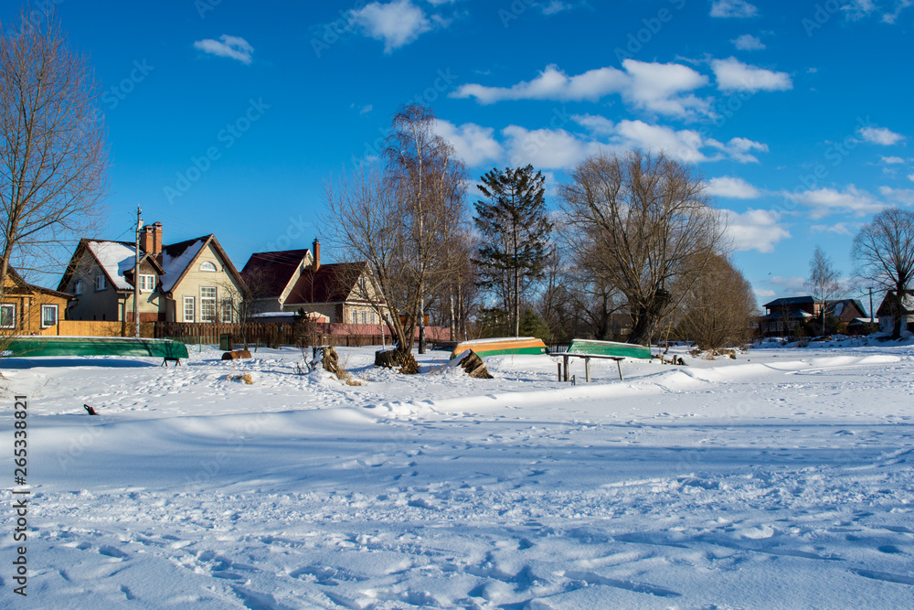 Winter landscape village on a sunny day with blue sky Winter landscape village on a sunny day with blue sky