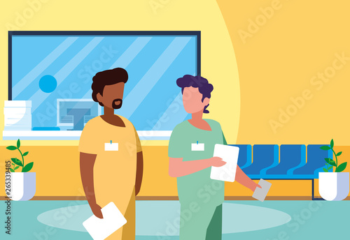 interracial male medicine workers in clinic reception