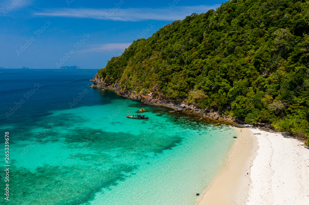 Aerial drone view of a beautiful deserted tropical island with lush foliage and a sandy beach (Ahtet Le Ywe Island, Mergui Archipelago, Myanmar) Aerial drone view of a beautiful deserted tropical island with lush foliage and a sandy beach (Ahtet Le Ywe Island, Mergui Archipelago, Myanmar)