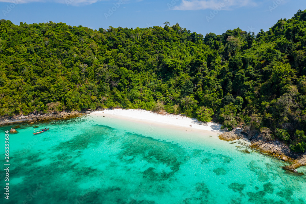 Aerial drone view of a beautiful deserted tropical island with lush foliage and a sandy beach (Ahtet Le Ywe Island, Mergui Archipelago, Myanmar)