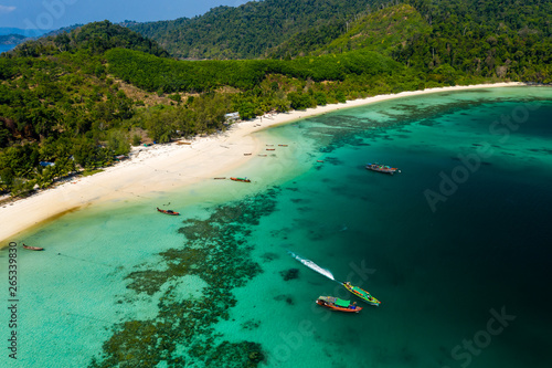 Aerial drone view of traditional longtail fishing boats on Great Swinton island, Mergui Archipelago, Myanmar