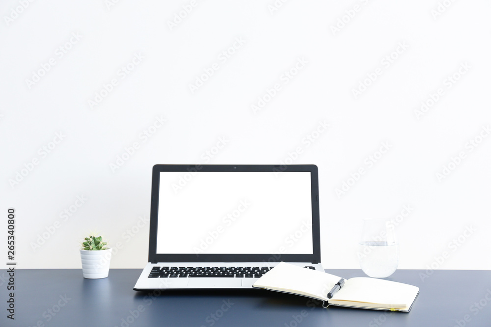 Flat lay on white wooden workspace with laptop computer, cell phone gadget, supplies, mini alarm clock & black coffee. Wood textured office desk. Deadline concept. Copy space, background, top view. Flat lay on white wooden workspace with laptop computer, cell phone gadget, supplies, mini alarm clock & black coffee. Wood textured office desk. Deadline concept. Copy space, background, top view.