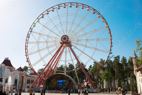 View of the Ferris wheel in the city park. 
