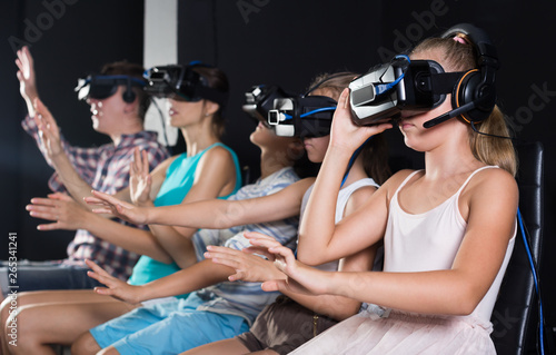 Parents with children in the room of virtual reality