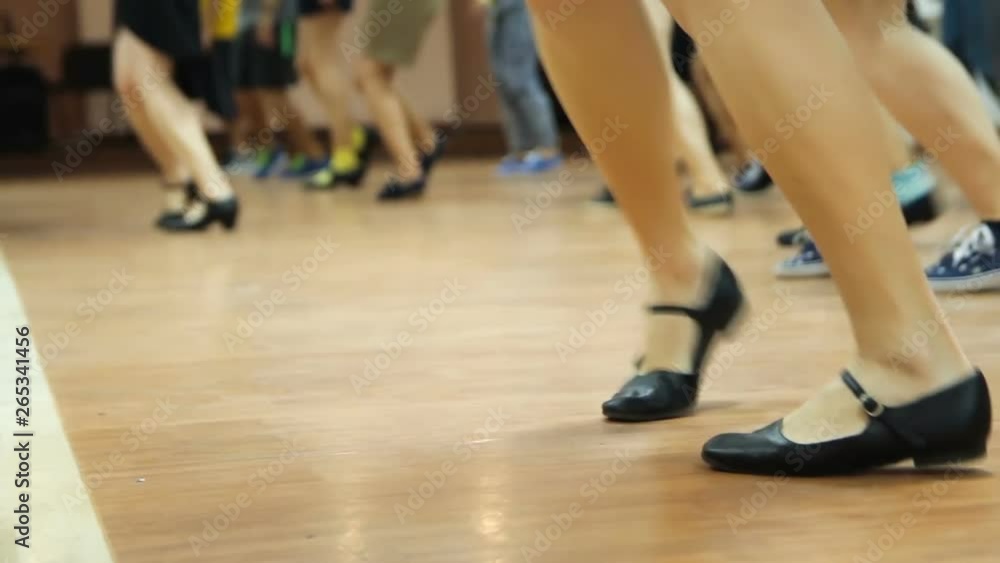 Looped video of dancing legs close-up. Dancers learning new moves. Woman teaching solo jazz swing dance. Looped video of dancing legs close-up. Dancers learning new moves. Woman teaching solo jazz swing dance.