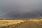 rainbow in a dark sky on the prairies