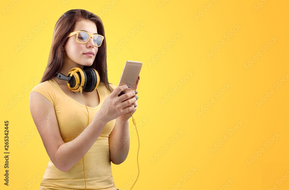 Portrait of confident young DJ with headphones on head mixing music on mixer Portrait of confident young DJ with headphones on head mixing music on mixer