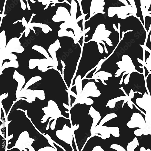 Seamless pattern with magnolia tree blossom in black and white. Floral background with branch and magnolia flower. Spring design with big floral outline elements. Hand drawn botanical illustration.