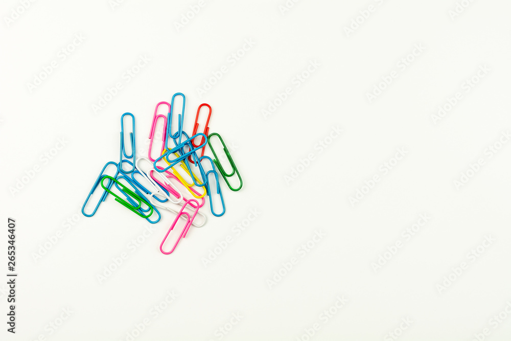 colorful paper clips on white background. - top view. colorful paper clips on white background. - top view.
