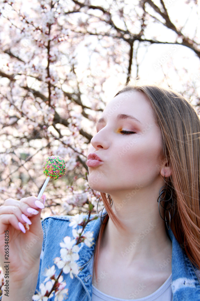 young woman with lilac flowers and lollipop young woman with lilac flowers and lollipop