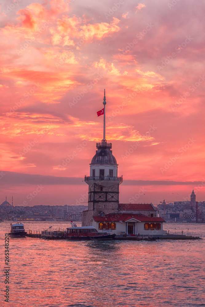 Amazing sunset view of Maiden's Tower (Kiz Kulesi) also known as Leander's Tower situated on Bosphorus, symbol of Istanbul, Turkey. Scenic travel background for wallpaper or guide book, vertical image