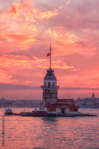 Amazing sunset view of Maiden's Tower (Kiz Kulesi) also known as Leander's Tower situated on Bosphorus, symbol of Istanbul, Turkey. Scenic travel background for wallpaper or guide book, vertical image