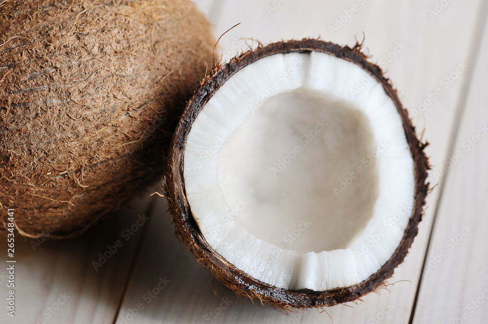 half-broken coconut on wooden half-broken coconut on wooden