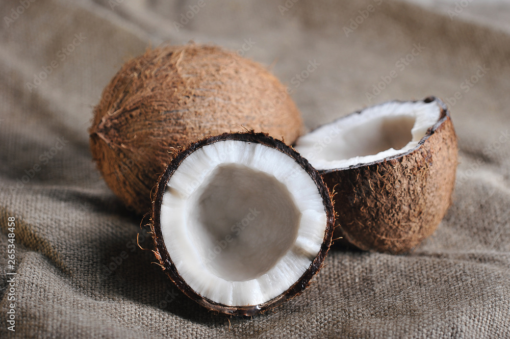 a whole coconut and a half-broken coconut