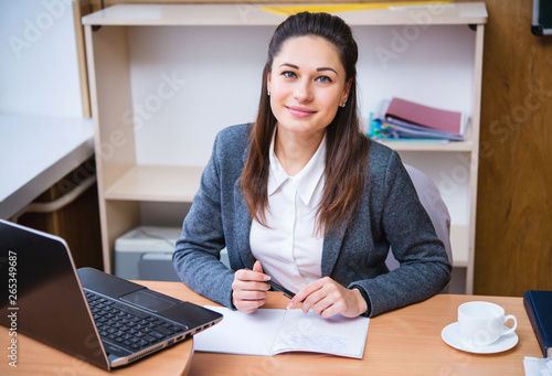 a teacher sitting at the desk